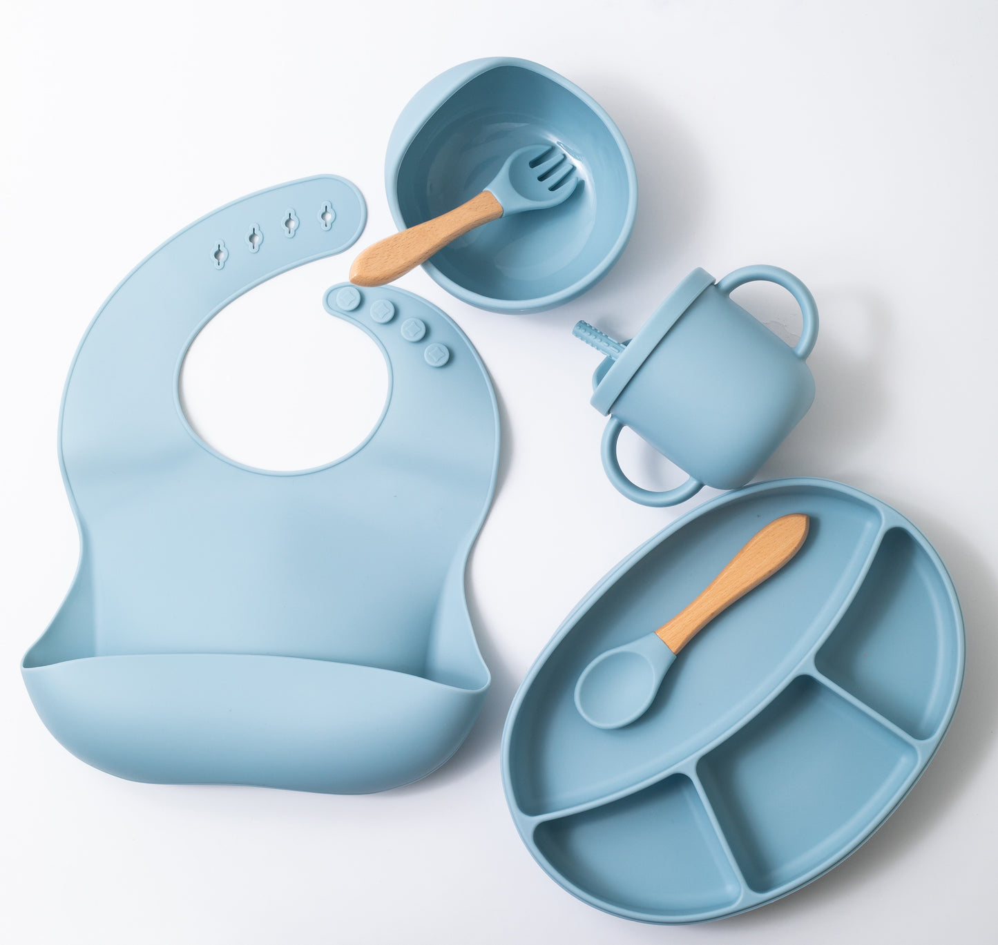 Silicon baby feeding dinner set having weaning bowl bib sectioned plate spoon sippy cup and fork in blue color