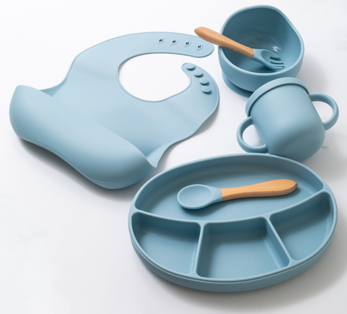 Silicon baby feeding dinner set having weaning bowl bib sectioned plate spoon sippy cup and fork in blue color