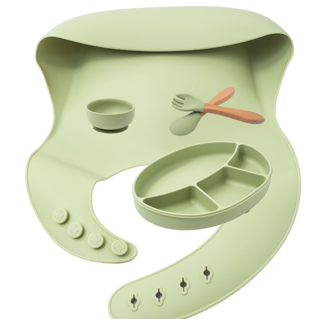 silion baby feeding dinner set having spoon fork round bowl sectioned plate and bib in green color