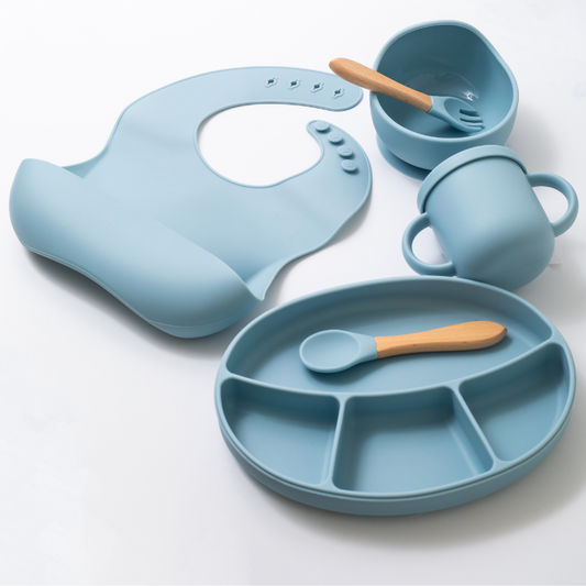 Silicon baby feeding dinner set having weaning bowl bib sectioned plate spoon sippy cup and fork in blue color