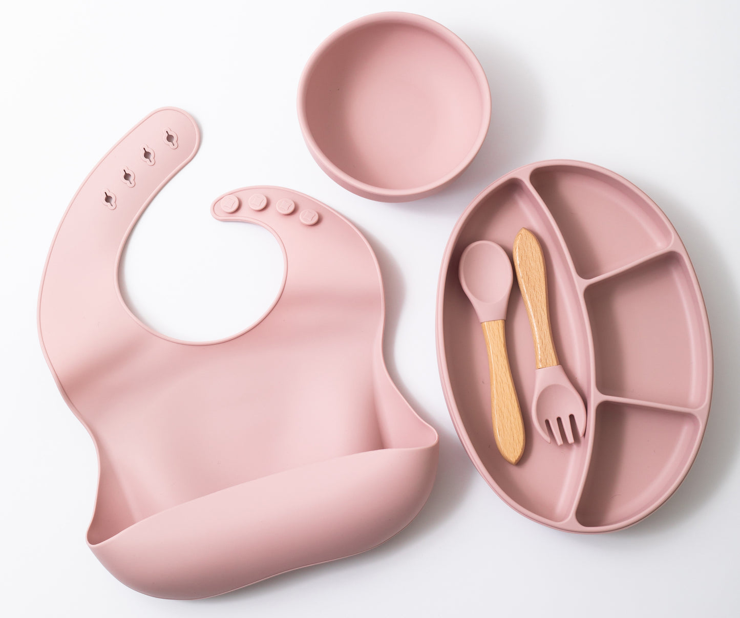 silion baby feeding dinner set having spoon fork round bowl sectioned plate and bib in pink  color