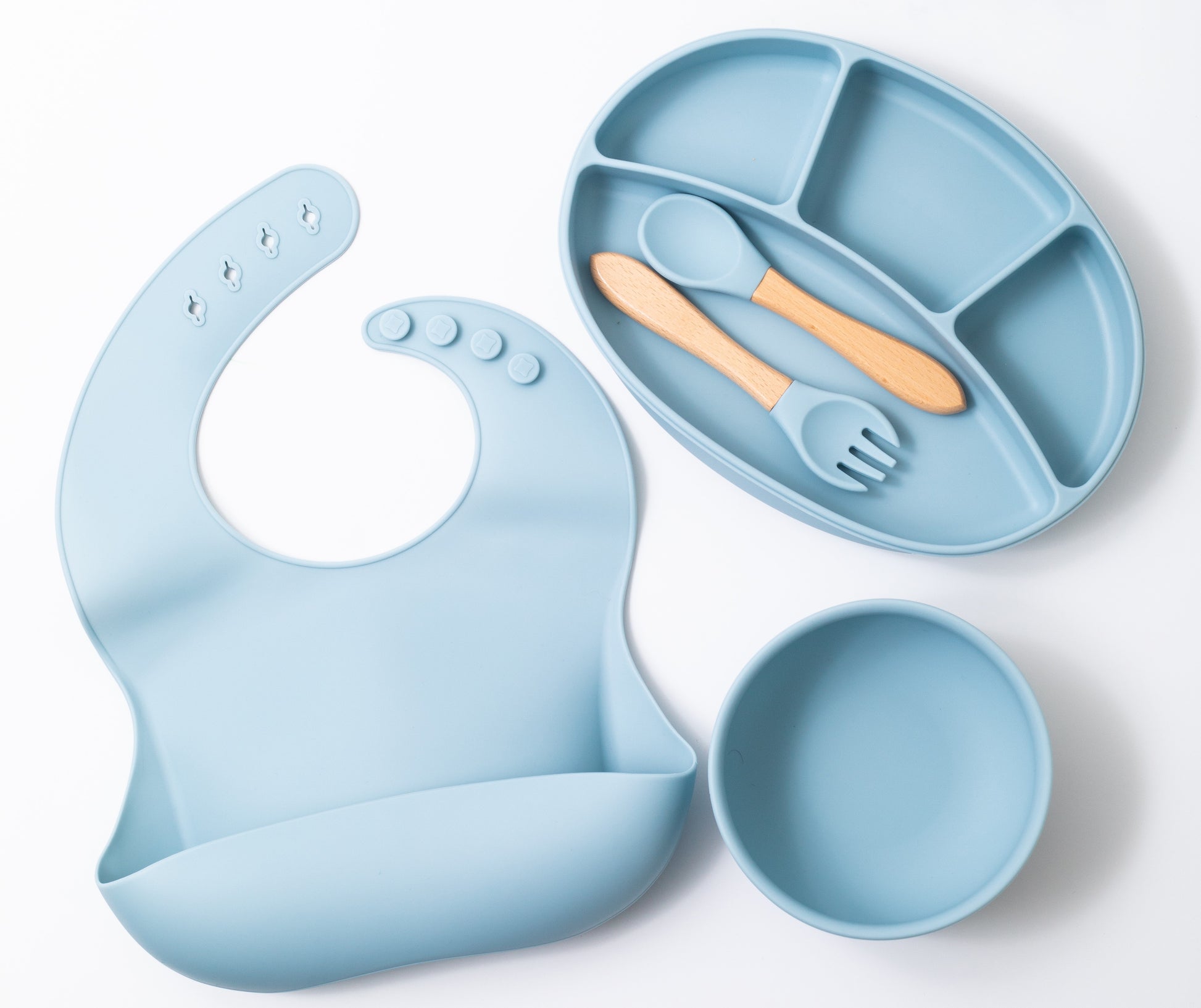 silion baby feeding dinner set having spoon fork round bowl sectioned plate and bib in blue color